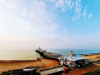 High angle view of ship by sea against sky