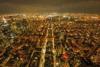 Aerial view of illuminated cityscape at night