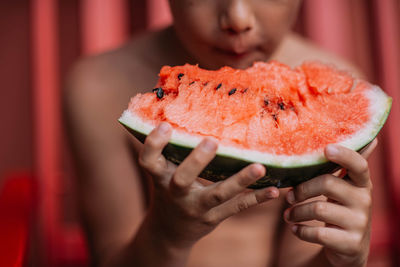 Close-up of woman holding fruit