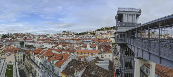 High angle view of buildings in town against sky