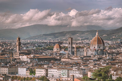 Duomo santa maria del fiore in city against cloudy sky