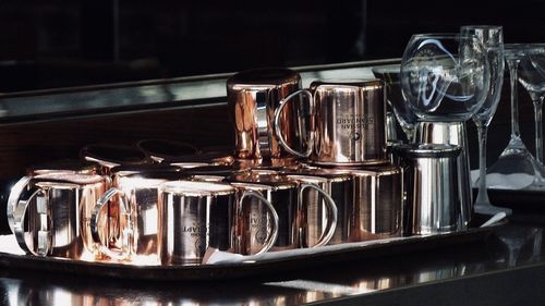 Close-up of wine glasses on table