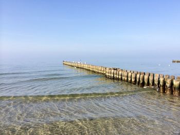 Pier over sea against sky