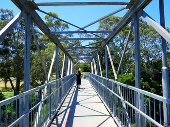 People walking on footbridge