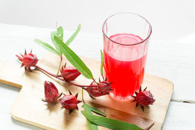 Close-up of drink with fruit on serving board