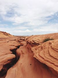 Rock formations in desert against sky