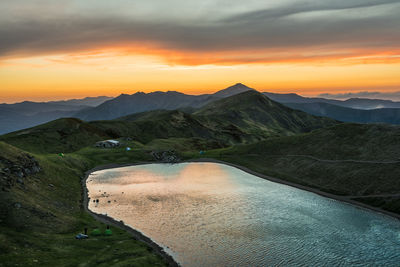 Scenic view of mountains against sky during sunset