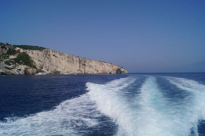 Scenic view of sea against clear blue sky