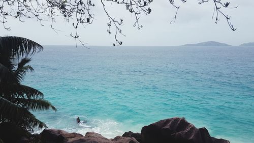 Scenic view of sea against clear blue sky