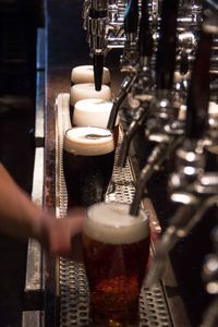 Close-up side view of beer dispensers