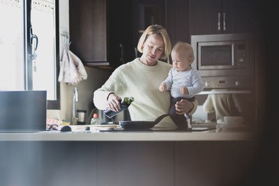 Portrait of smiling young woman working at home