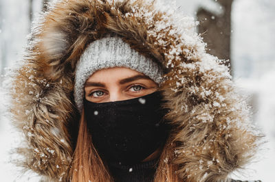 Portrait of woman with snow covered face