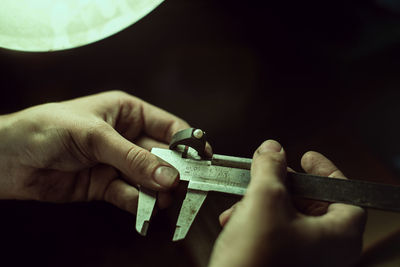 Close-up of holding vernier caliper