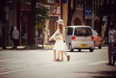 Woman standing on city street