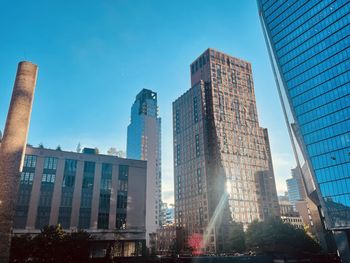 Low angle view of skyscrapers against clear sky