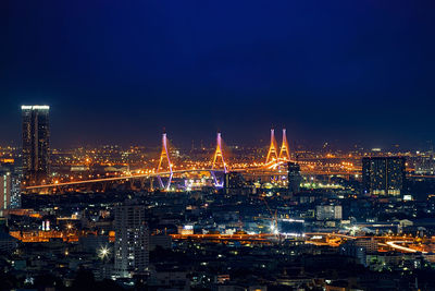 Illuminated buildings in city at night