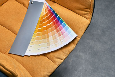 High angle view of multi colored paper on table