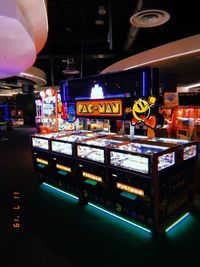 Low angle view of illuminated lighting equipment on table in city at night