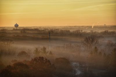 Scenic view of landscape against sky during sunset