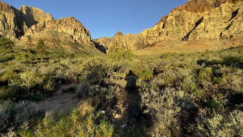 Rock formations on landscape against sky