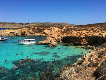 Scenic view of sea against clear blue sky