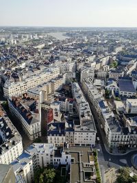 High angle view of city buildings against sky