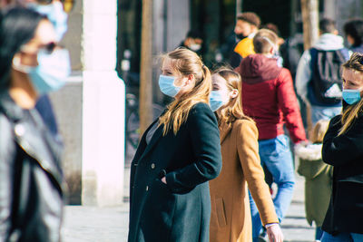 People walking on street in city