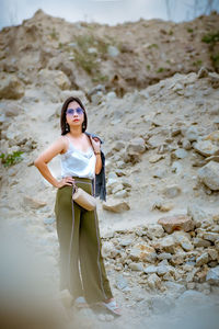 Beautiful woman standing on rocks