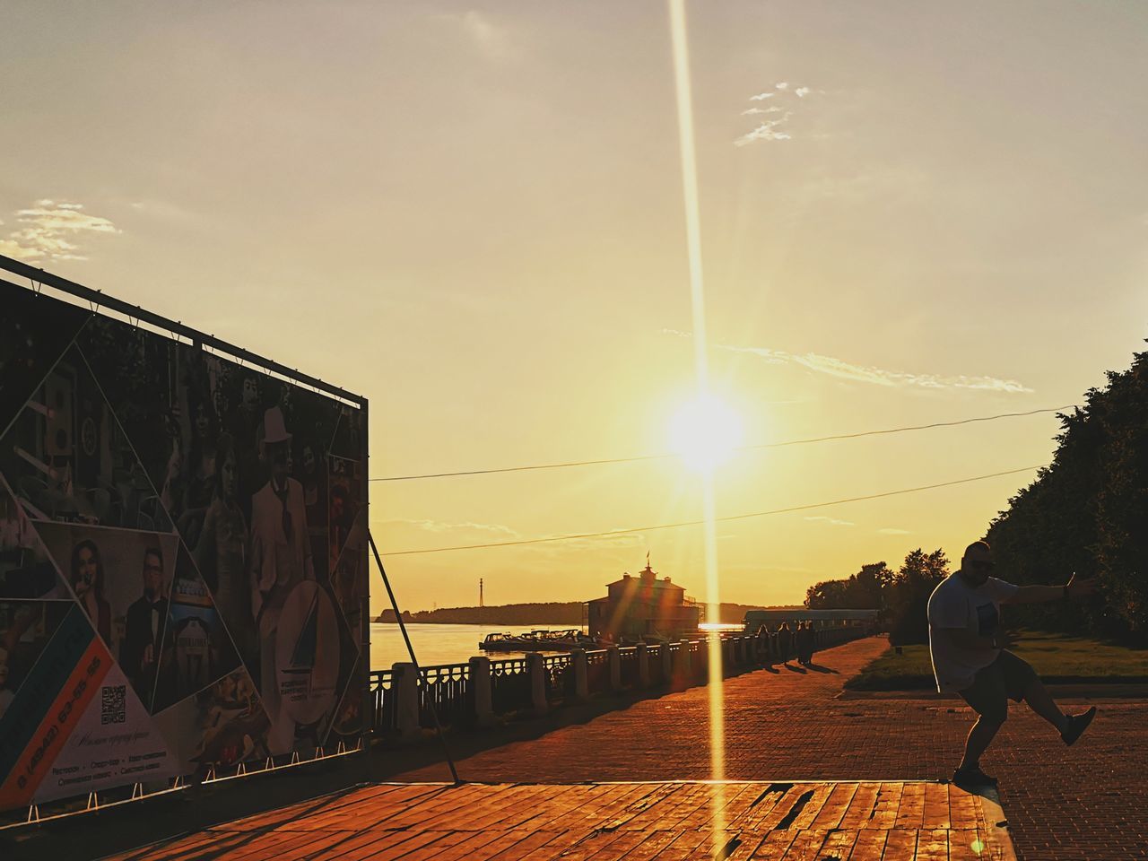 PEOPLE ON BRIDGE DURING SUNSET