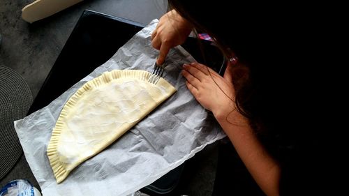 High angle view of woman preparing food