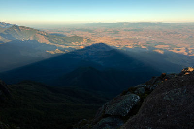 Aerial view of snowcapped mountains against sky