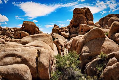 Low angle view of rock formations against sky