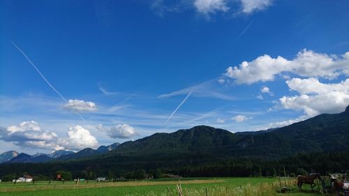 Scenic view of landscape against cloudy sky