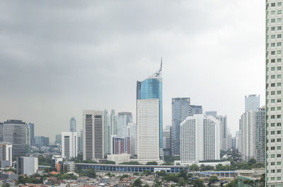 Modern buildings in city against sky