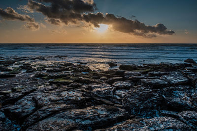 Scenic view of sea against sky during sunset