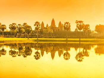 Scenic view of lake against sky during sunset