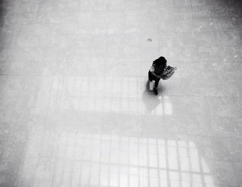 High angle view of man reading newspaper