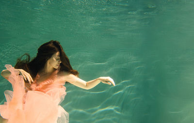 Woman swimming in pool