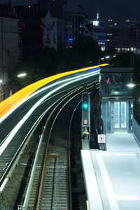 Light trails on street in city at night