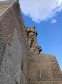 Low angle view of statue against sky