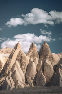 Rock formations on mountain against sky