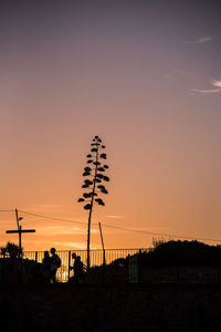 Silhouette people at sunset