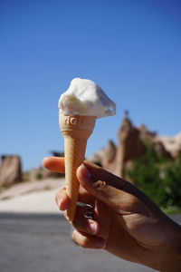 Midsection of person holding ice cream