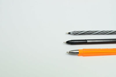 High angle view of pencils on white table