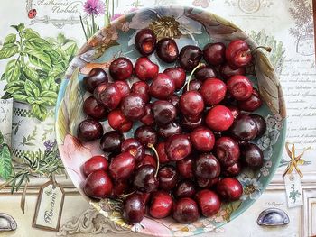 High angle view of strawberries in plate on table