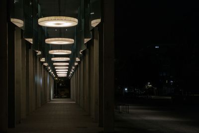 Empty illuminated street lights at night