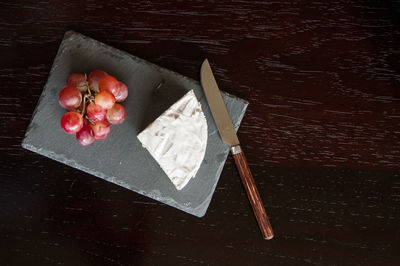 High angle view of fruits on cutting board