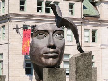 Low angle view of statue in city