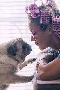 Side view of girl with dog