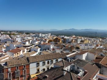 High angle shot of townscape against clear blue sky